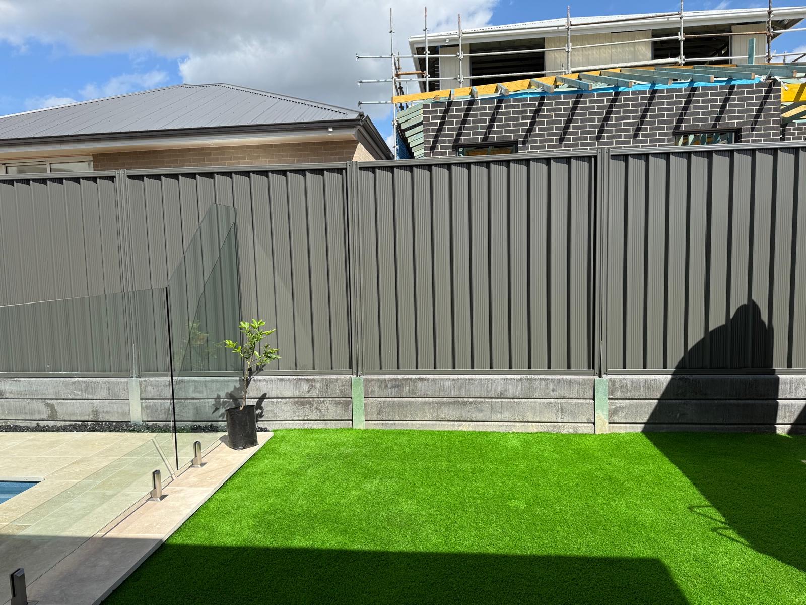 Architectural landscaping Sydney - corten steel garden edging with decorative pebble and drought tolerant plants